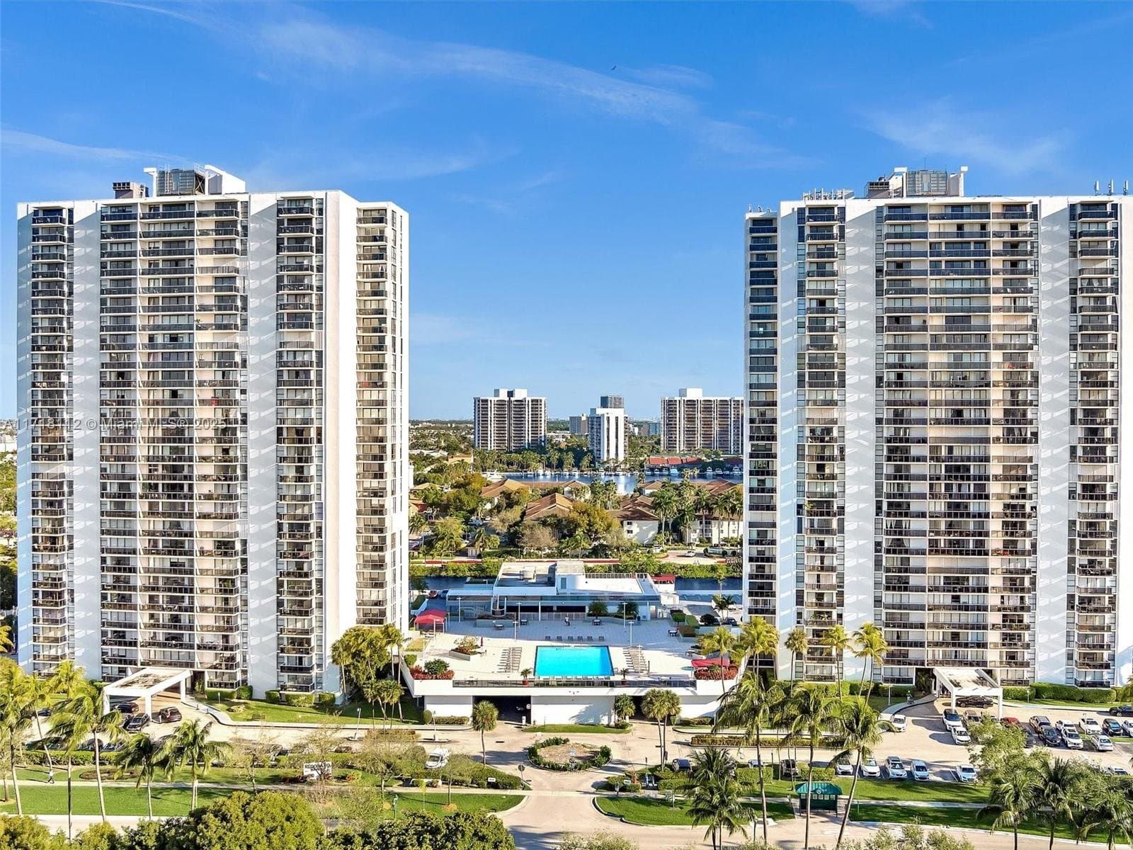 Both Eldorado towers with the pool deck and marina, seen from above